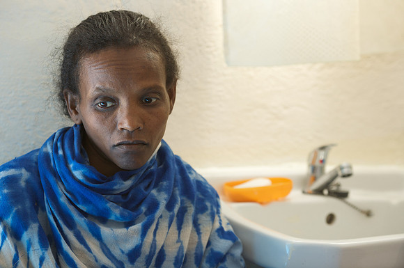 Zewdinish lives under sheet of plastic with her two children.